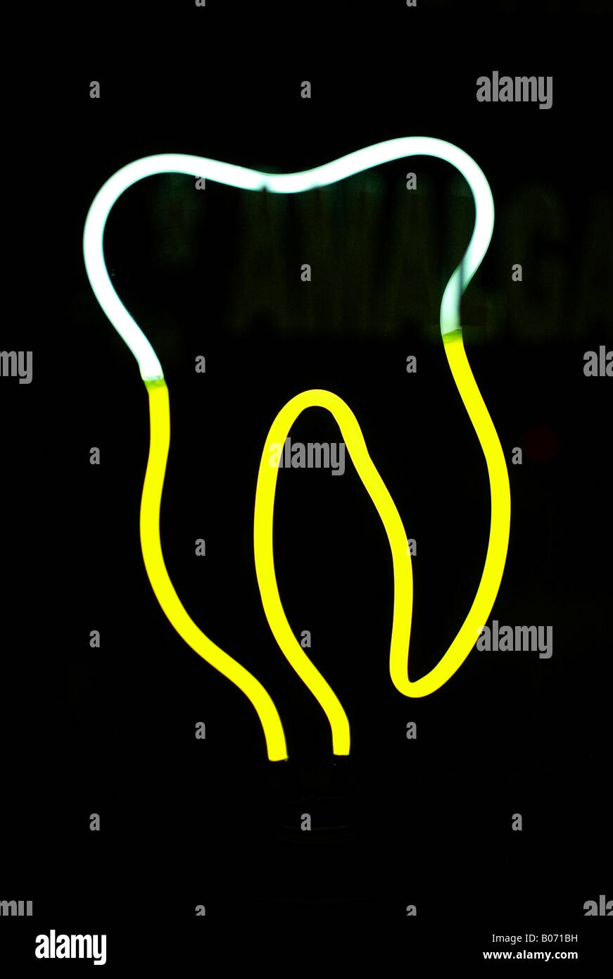 Neon sign depicting an extracted tooth in vivid yellow and white