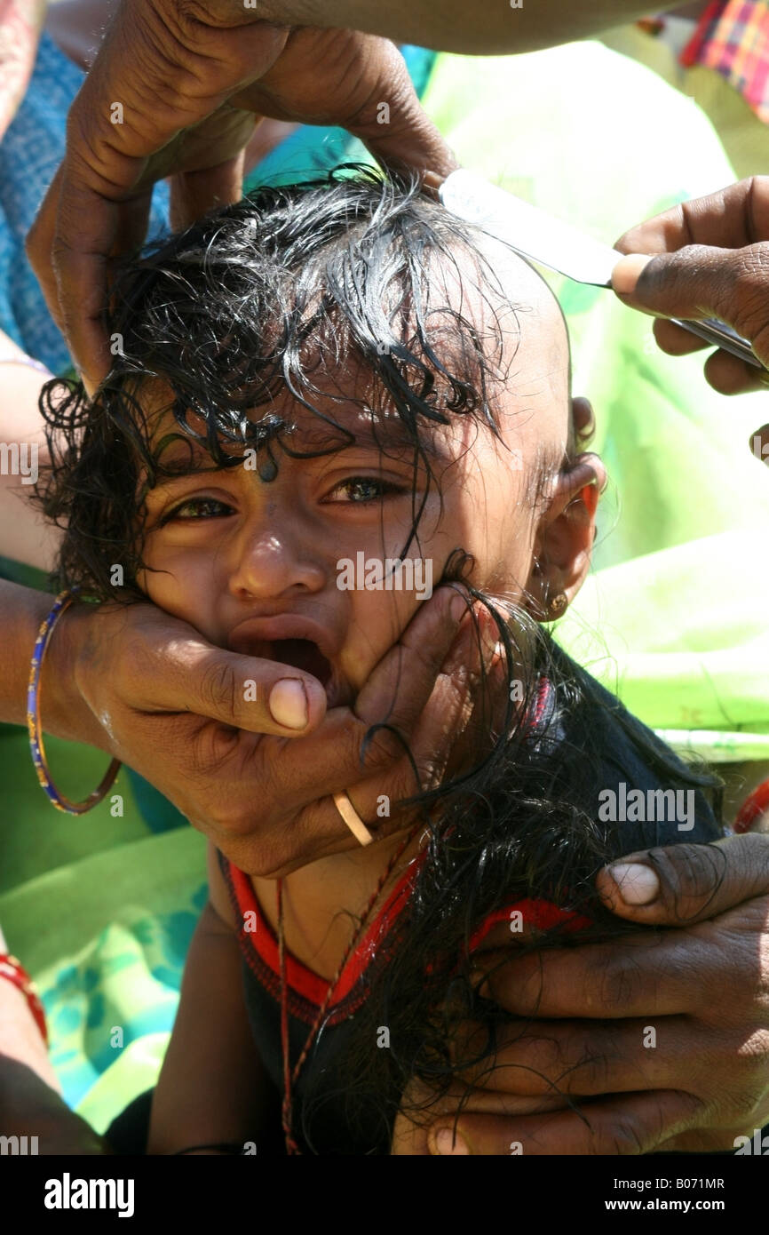 Young Hindu having his head shaved during the Namakaran Ceremony, Tamil