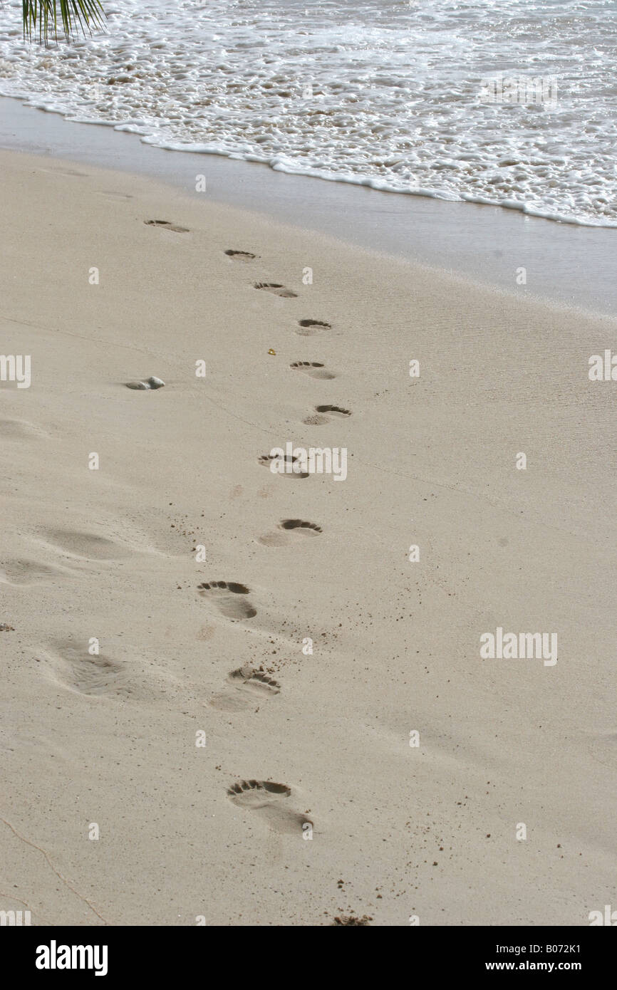 Footprints into water Stock Photo