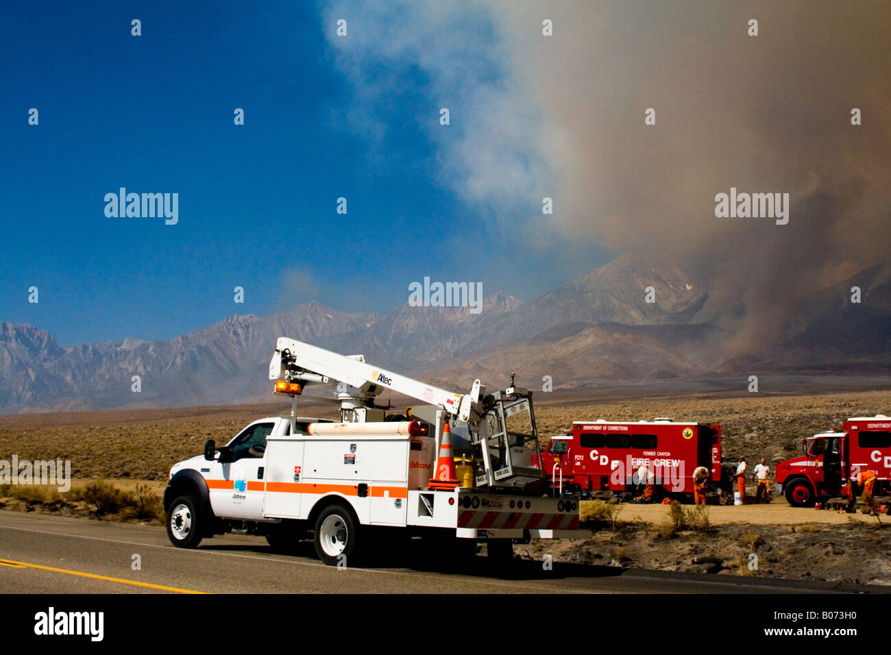 Power repair truck on Hwy 395 on the eastern side of the Sierra Nevada Mts. after a massive forest fire July 2007 Stock Photo