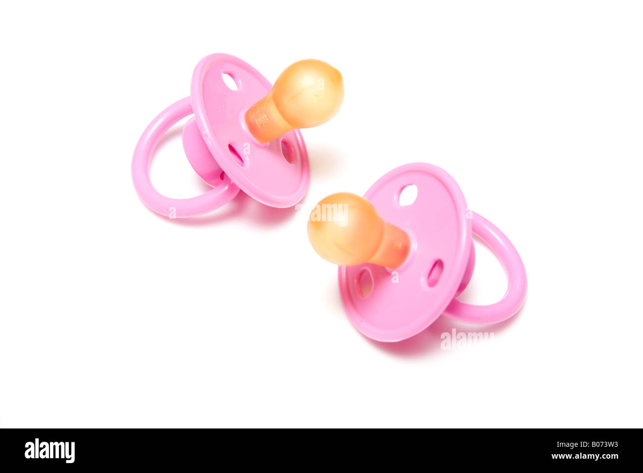 Babies dummies or pacifiers isolated on a white studio background. Stock Photo