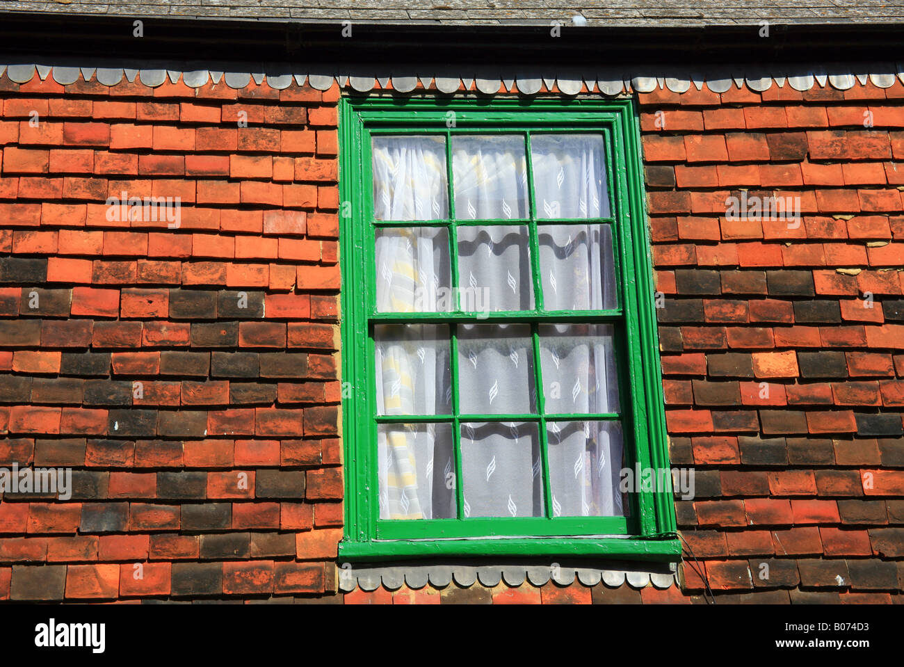 green windows and traditional kent peg tiles above the Nutmeg Cafe