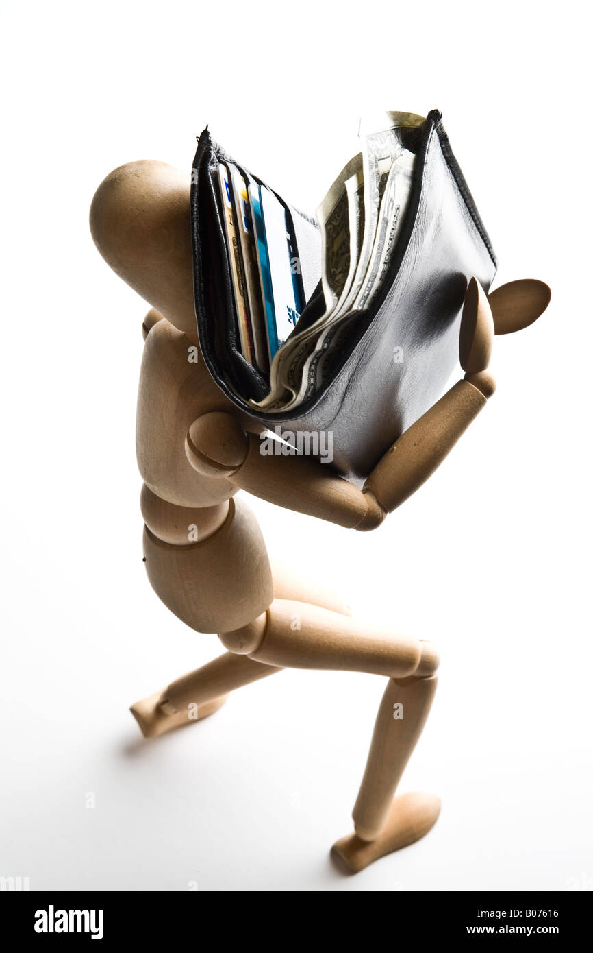 Manikin carrying a wallet full of money Stock Photo
