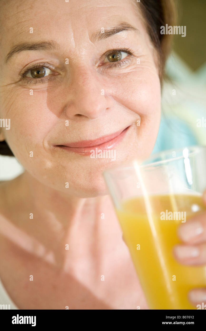 Drinking Orange Juice Stock Photo Alamy