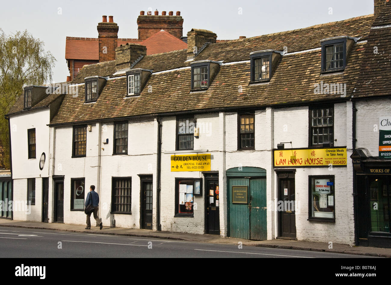 A row of old terraced cottages now used as Chinese Take Aways. Stock Photo