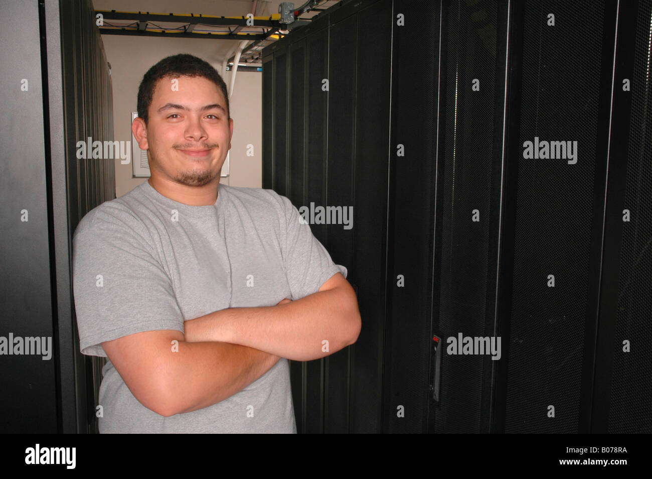 Hispanic technician in a computer server room Stock Photo