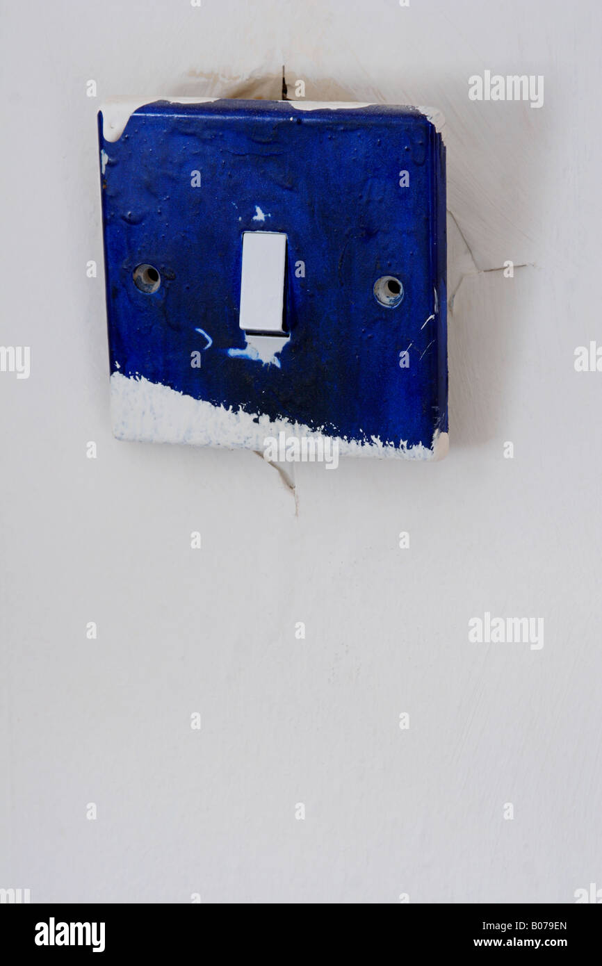 broken blue light switch close up Stock Photo