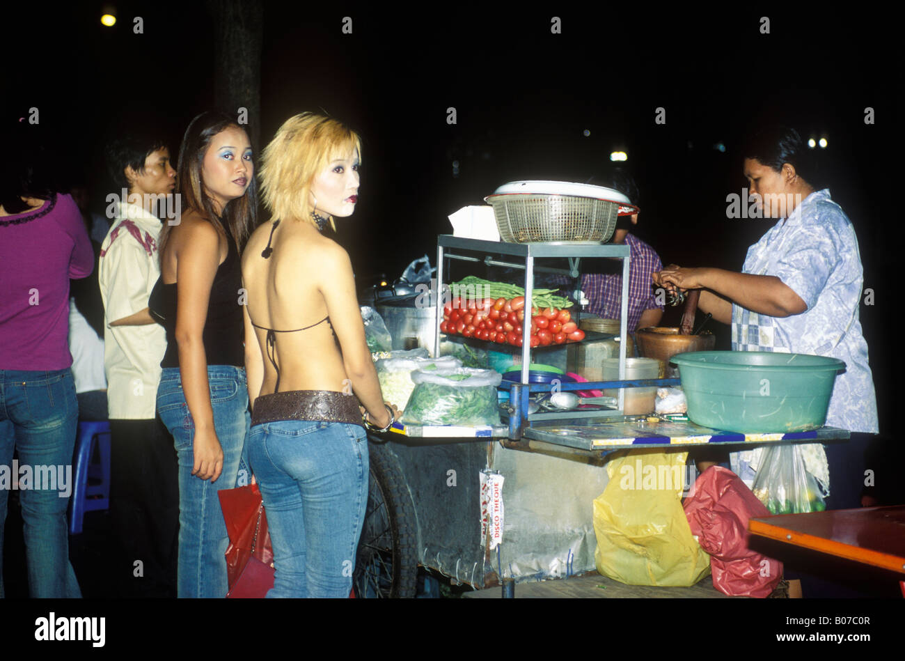 Young Thai People Buying Snack From Food Cart At Night Bangkok Thailand Stock Photo