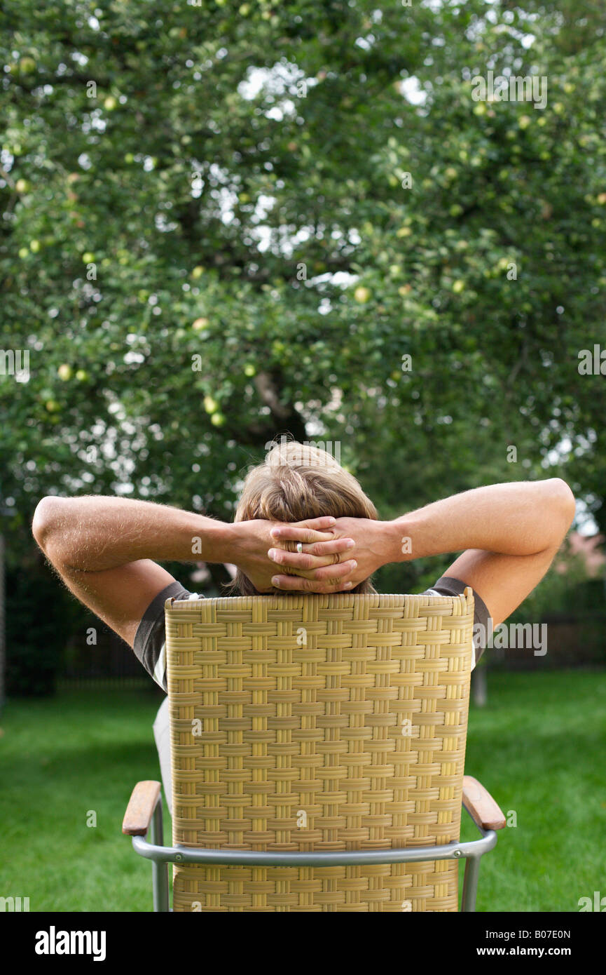 Relaxed man sitting in a lawn chair Stock Photo Alamy
