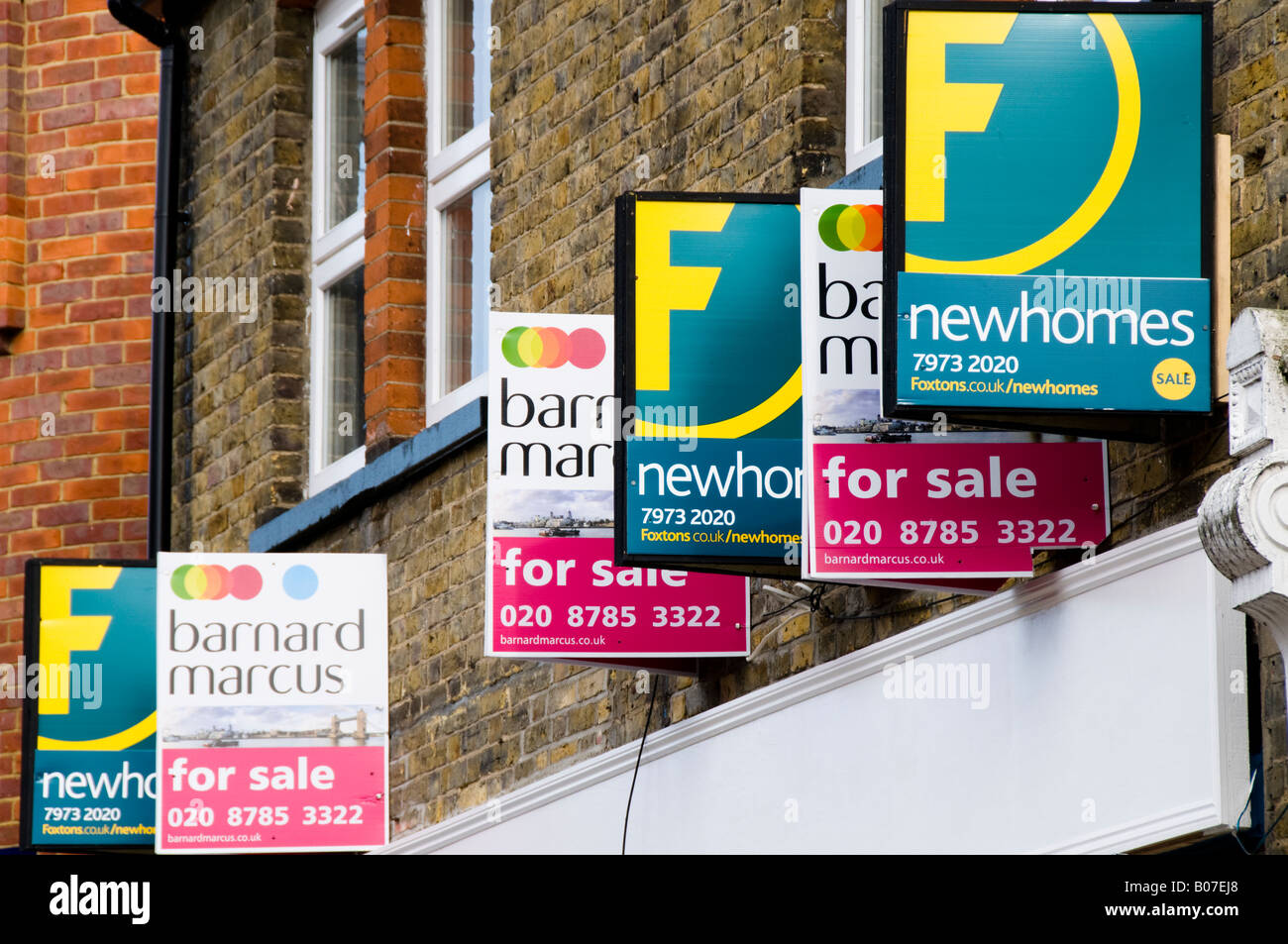 For Sale Signs of various Estate Agents Stock Photo