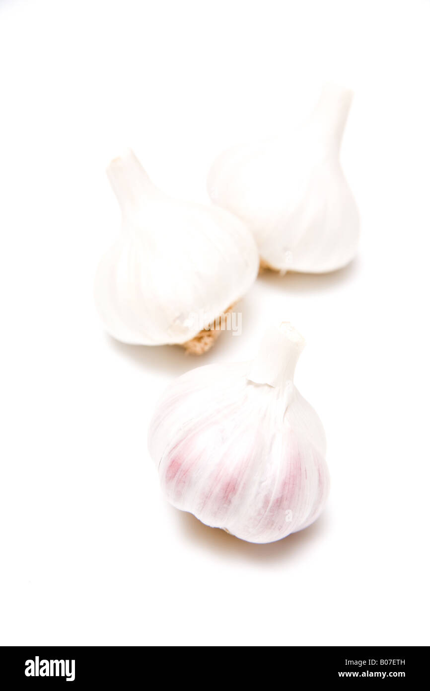 Garlic bulbs isolated on a white studio background Stock Photo - Alamy