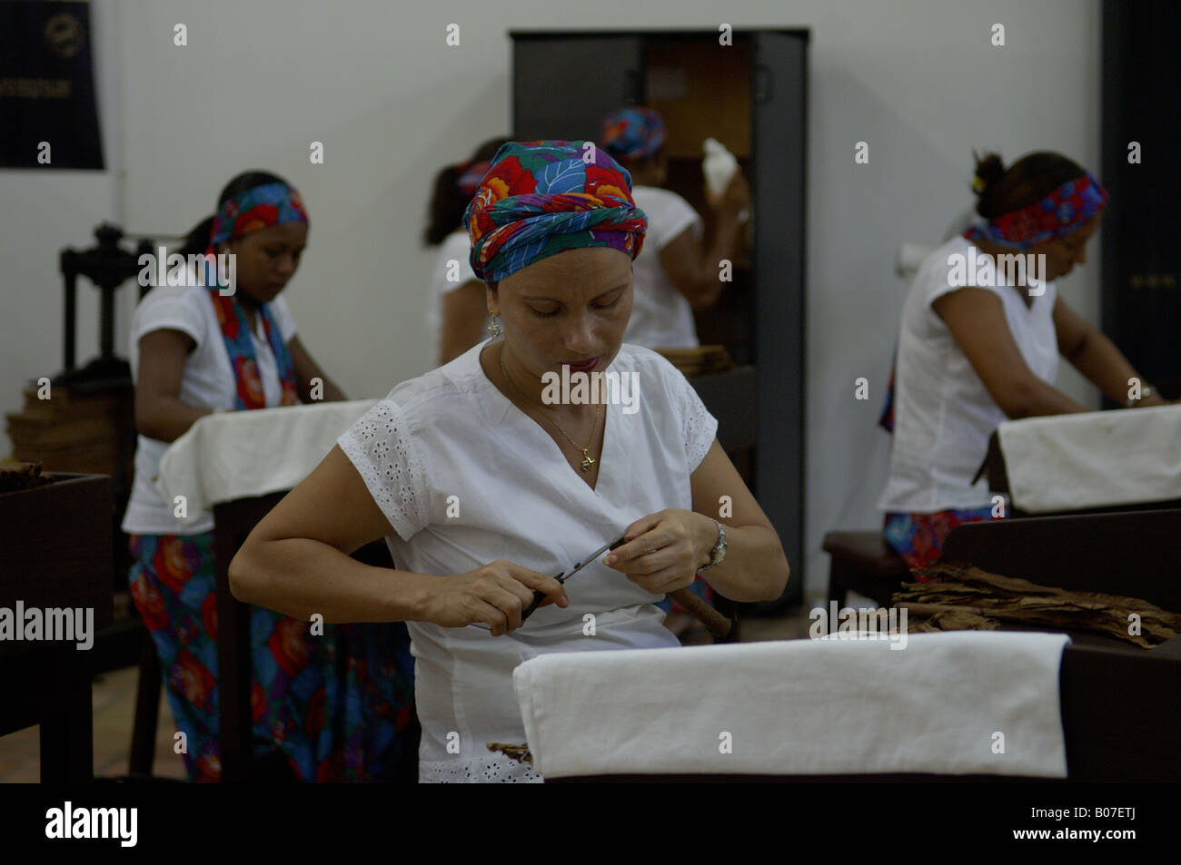 Women working in the hand-made cigars factory in Sao Felix city in Bahia, a northeastern State in Brazil. Stock Photo