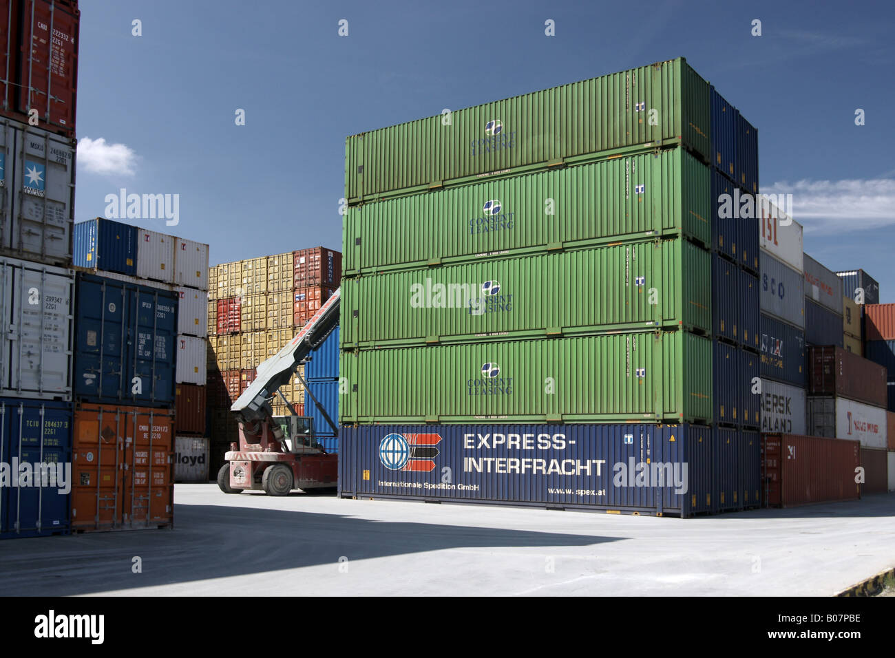 Stacks of cargo containers with vehicle / Frachtcontainer mit Fahrzeug Stock Photo