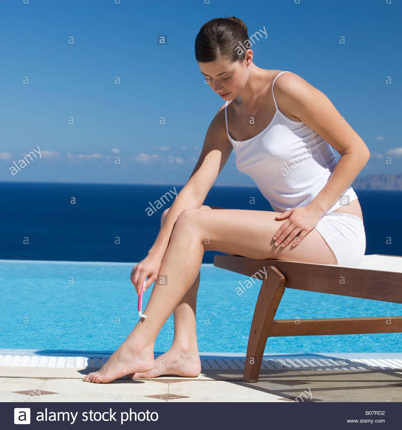Woman Shaving Her Legs Stock Photos & Woman Shaving Her Legs Stock