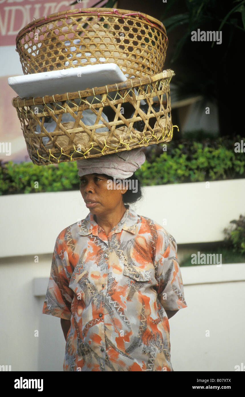 Bali Woman Balancing Baskets On Her Head Indonesia Stock Photo - Alamy