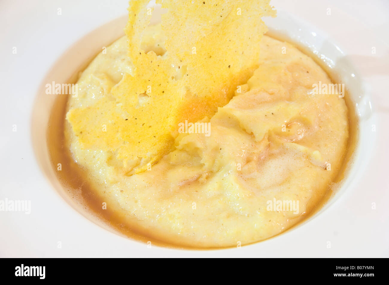 Tipical italian dish, polenta with cheese Stock Photo