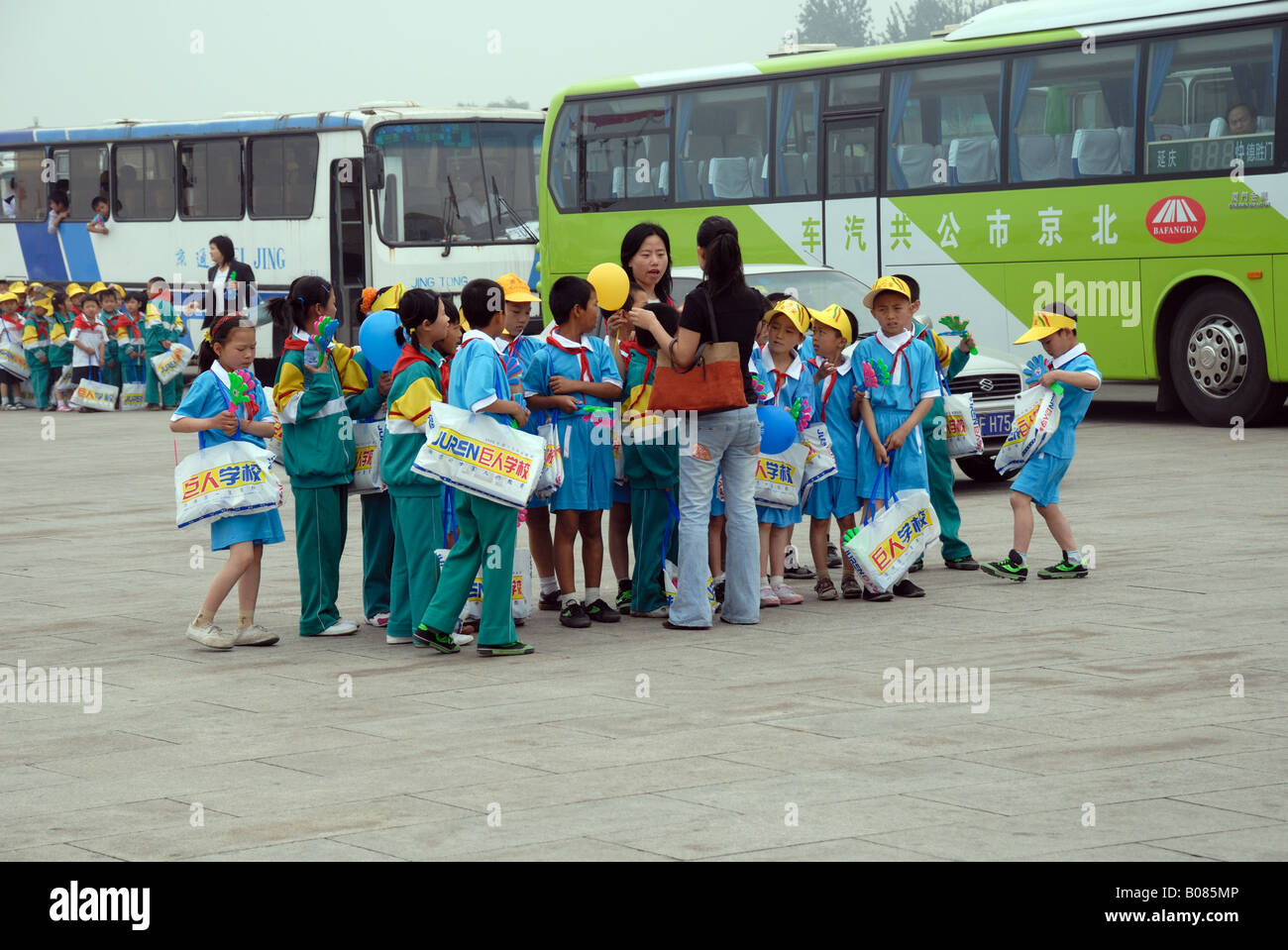 Schoolchildren and teachers visiting Tiananmen Square China Asia Beijing Peking City Stock Photo
