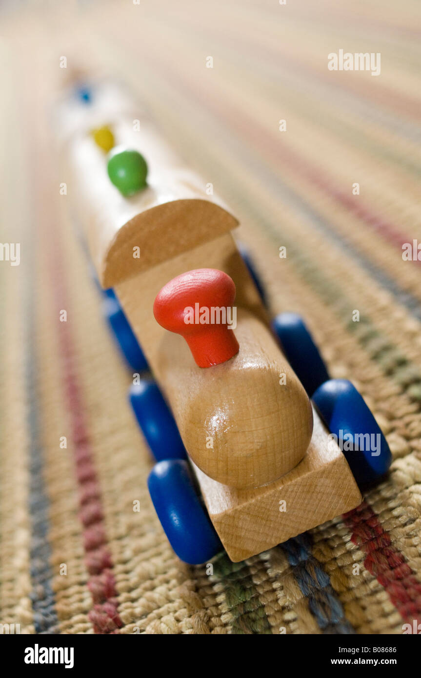 Wooden toy train on carpet Stock Photo Alamy