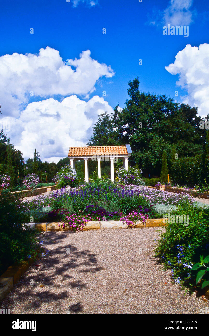 Path and blue flower bed in the Arboretum Ellerhoop Stock Photo