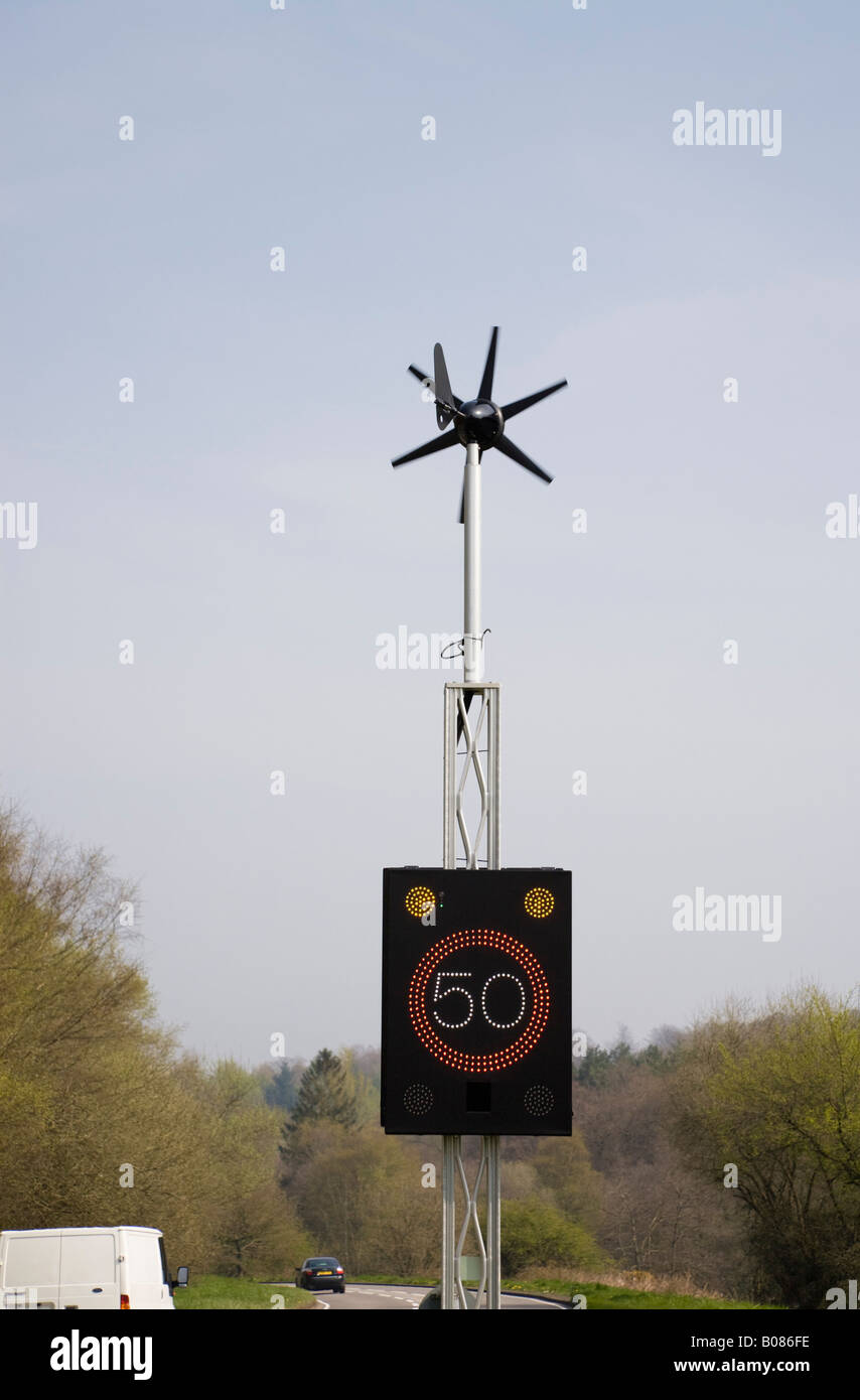 England UK Wind powered 50 mph speed sign illuminated by vehicle on country main road Stock Photo
