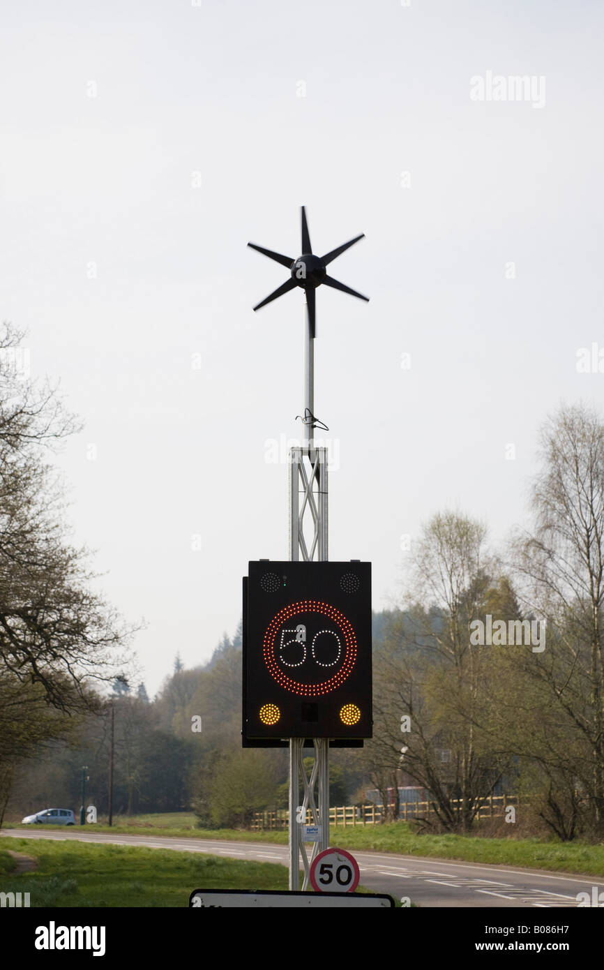 West Sussex England UK Wind powered 50 mph speed sign illuminated on country main road Stock Photo