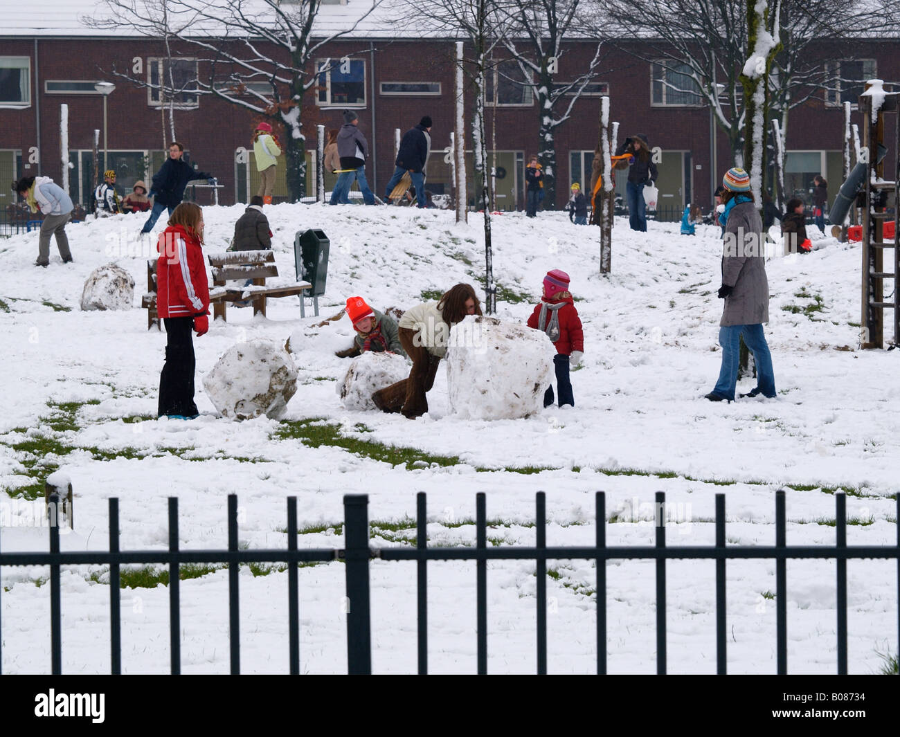 Many children kids playing in rare winter snow in a park in Breda the Netherlands Stock Photo