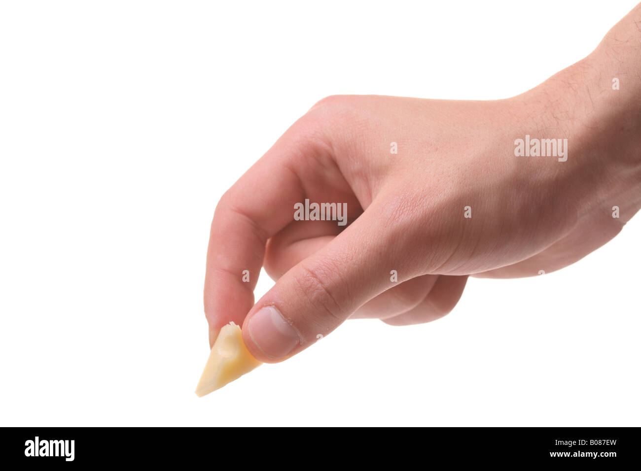 Hand holding a piece of cheese Stock Photo