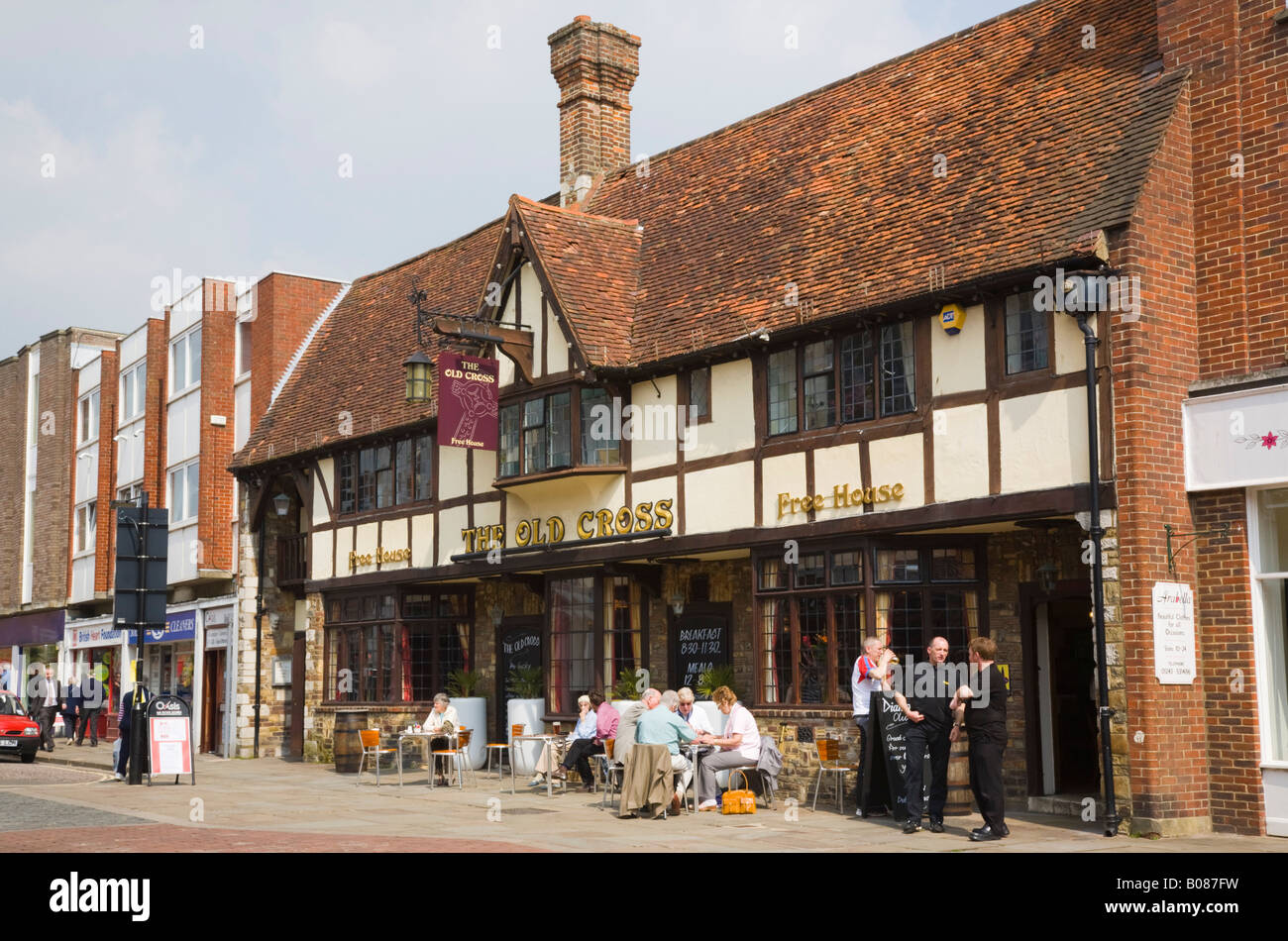 The Old Cross pub with people sitting at tables outside. Chichester West Sussex England UK Britain Stock Photo