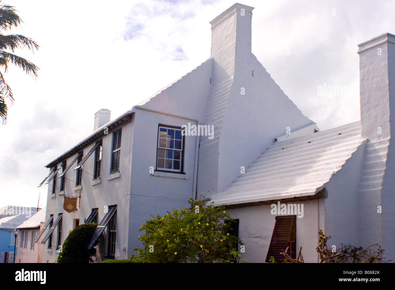 white painted dwellings in the back streets of St George s Town on Bermuda Stock Photo