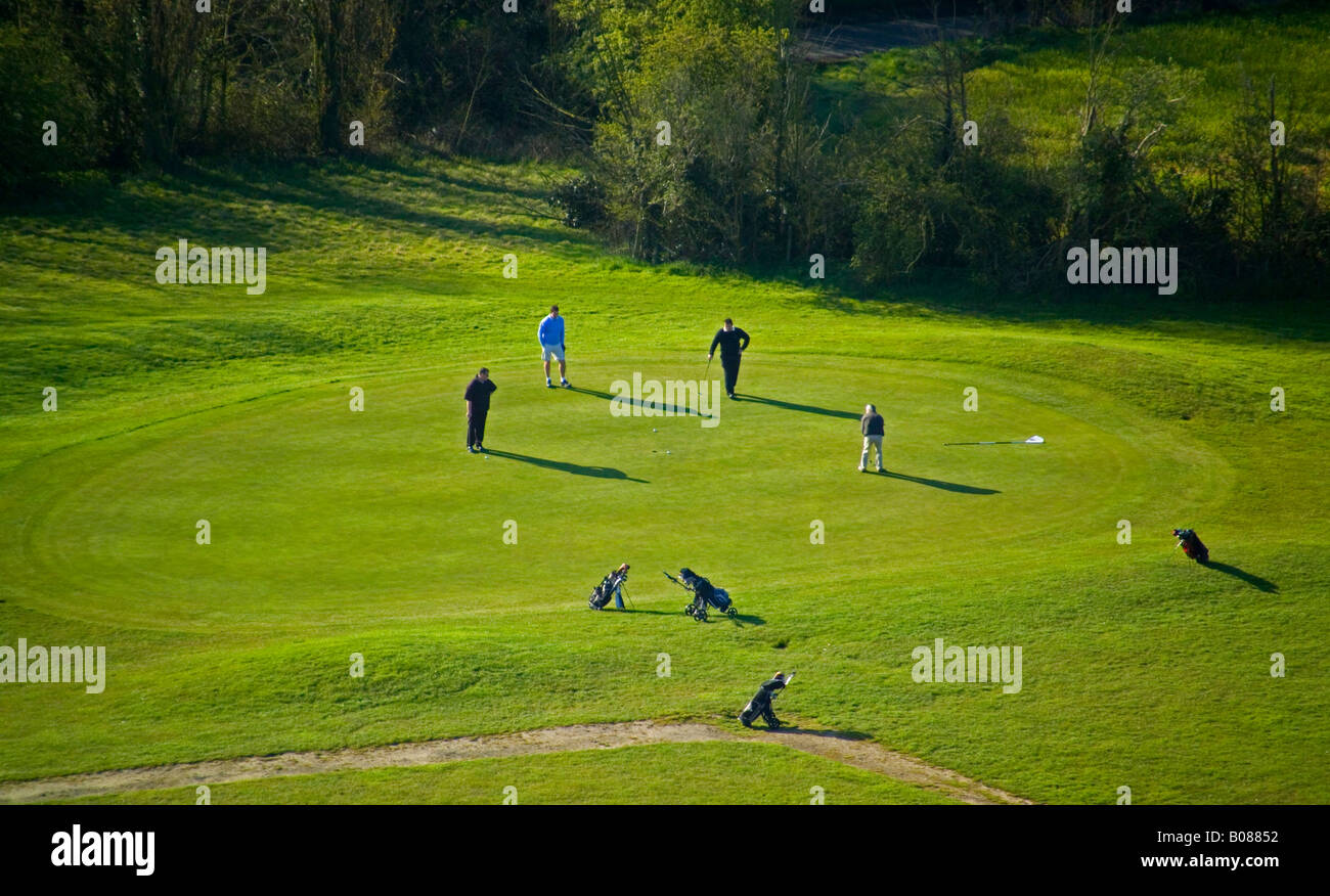 golf players on the putting green Stock Photo