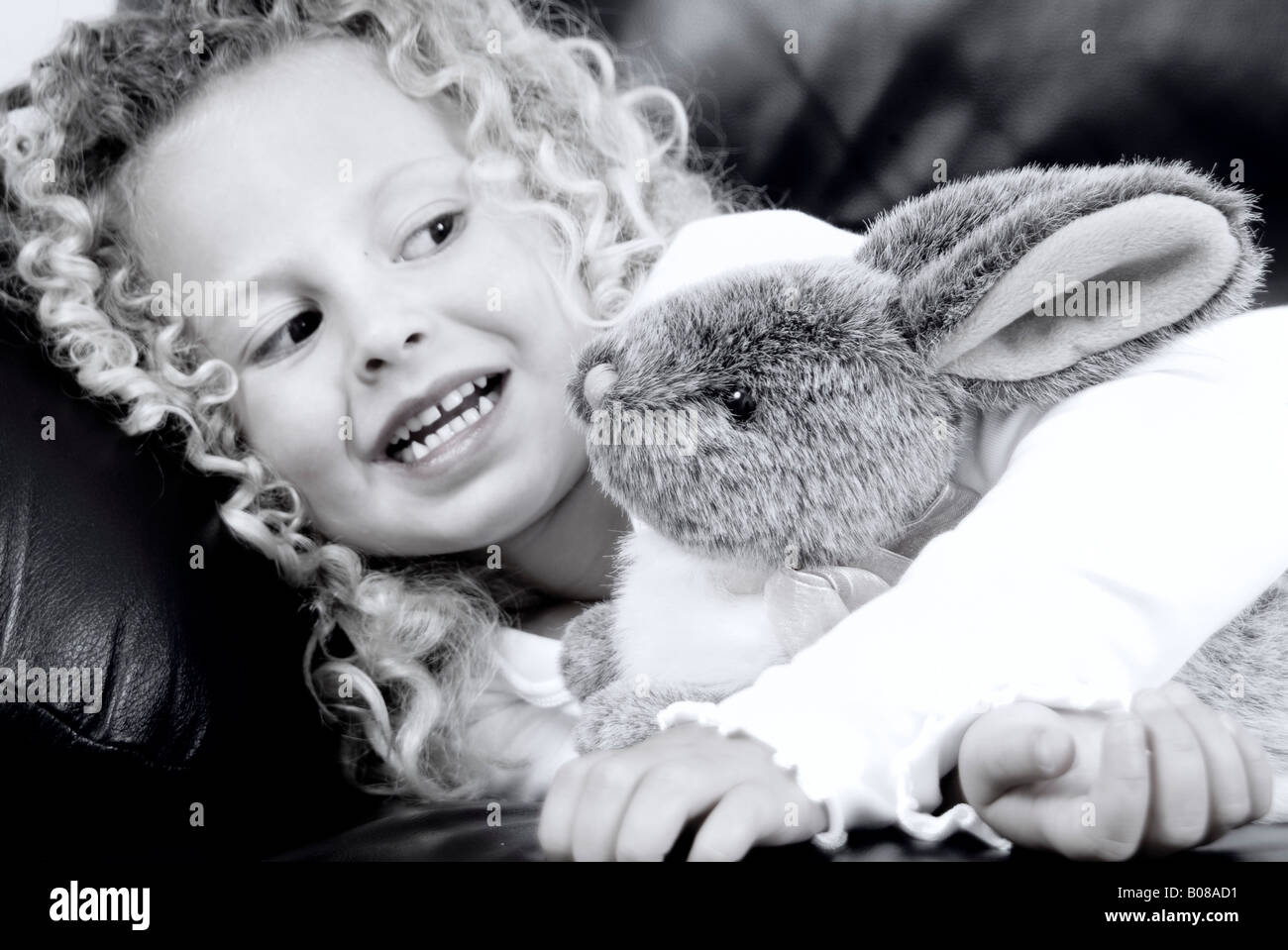 Little girl holding stuffed animal Stock Photo - Alamy