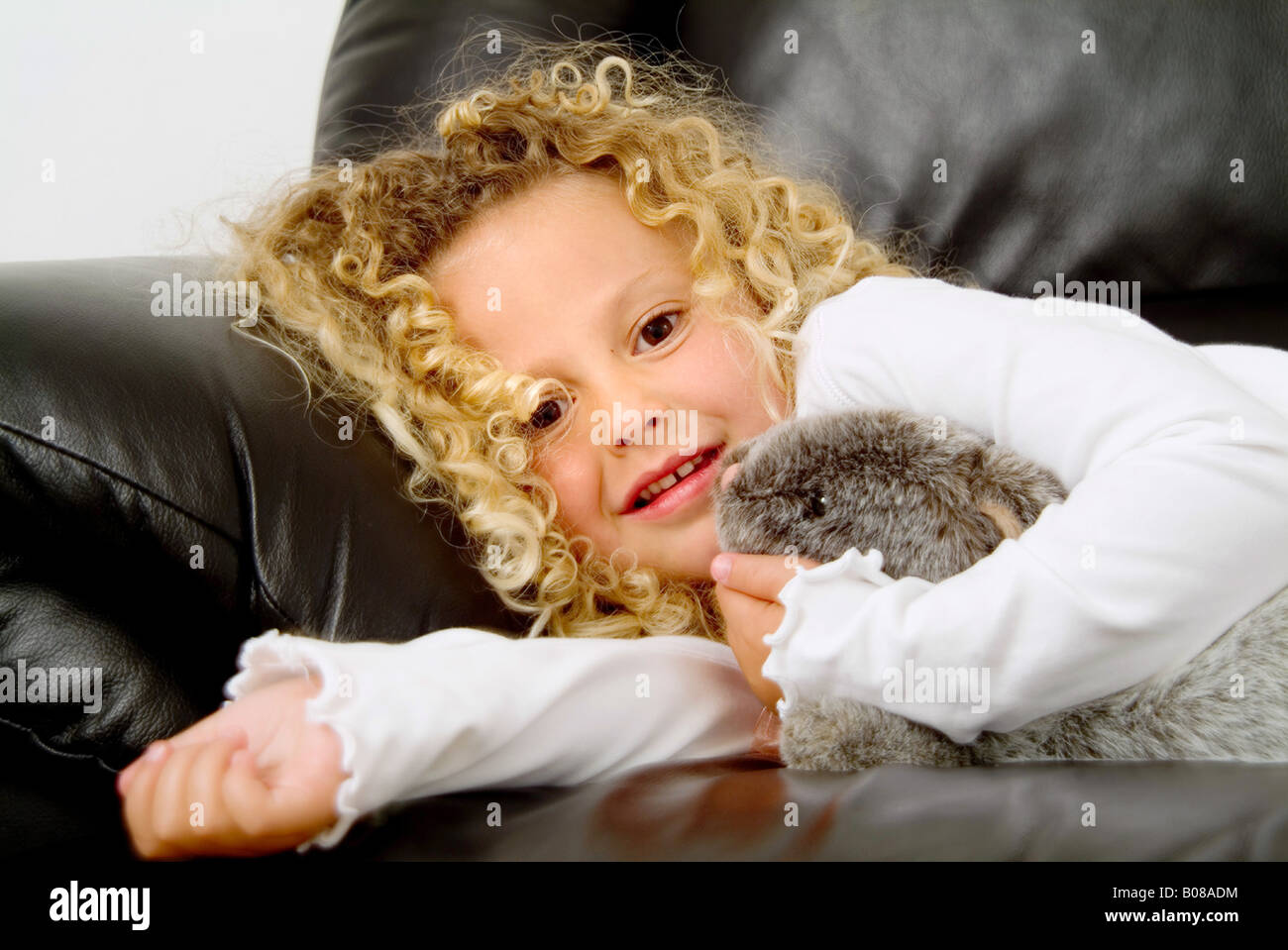 Little girl holding stuffed animal Stock Photo - Alamy