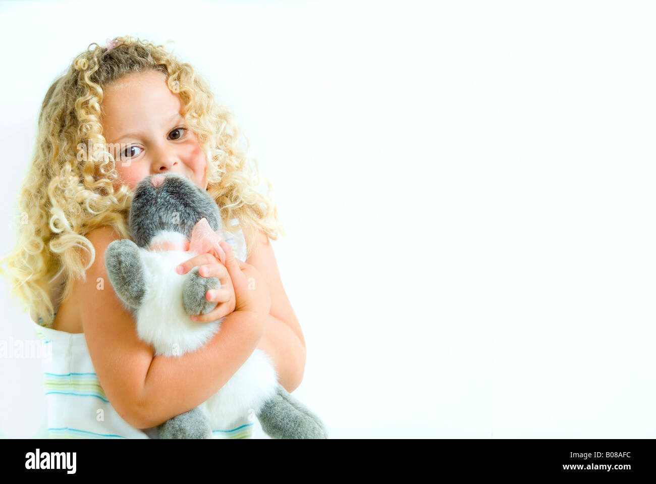 Little girl holding stuffed animal Stock Photo - Alamy