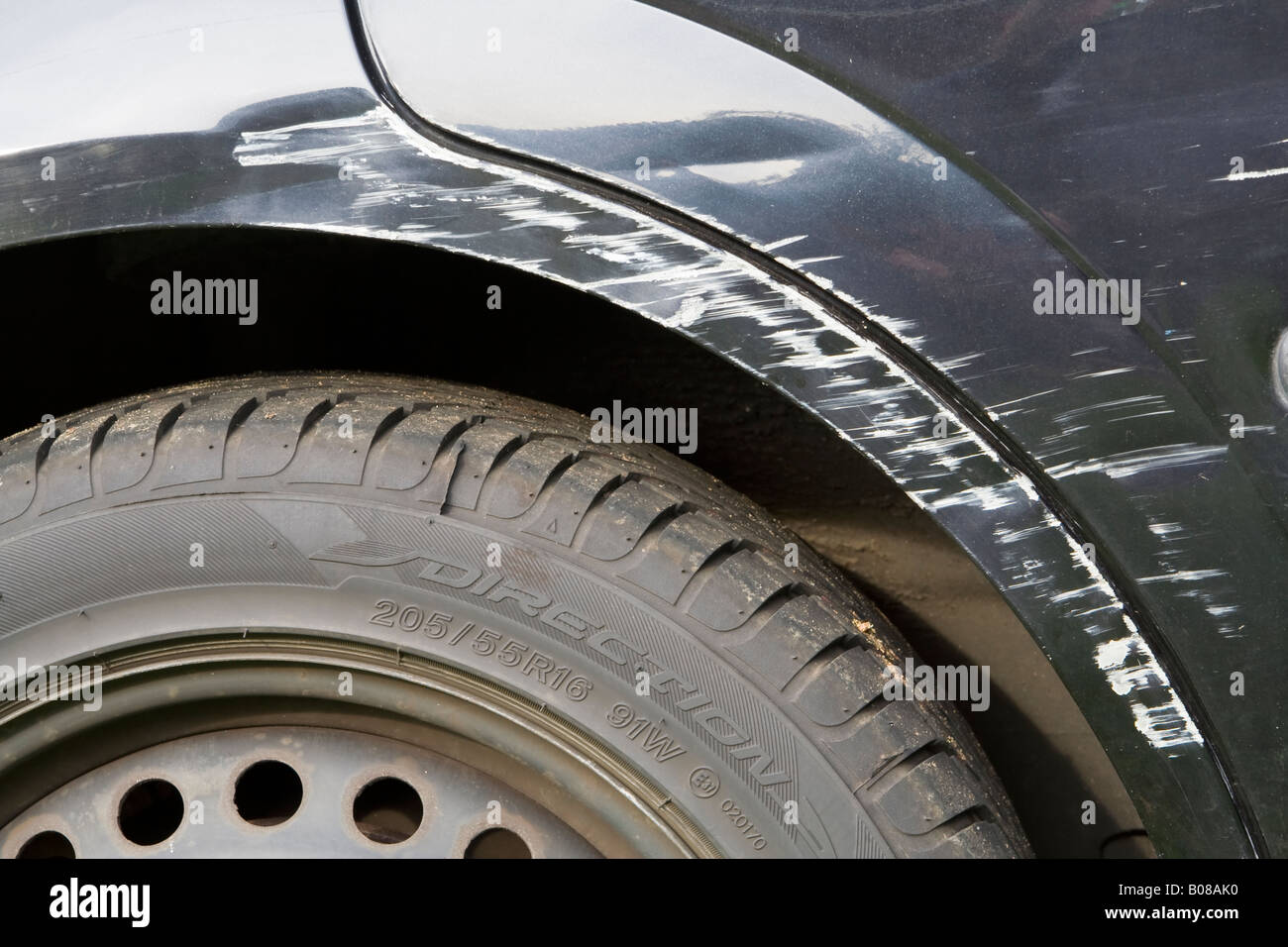 A ^damaged car wheel arch, UK. Stock Photo
