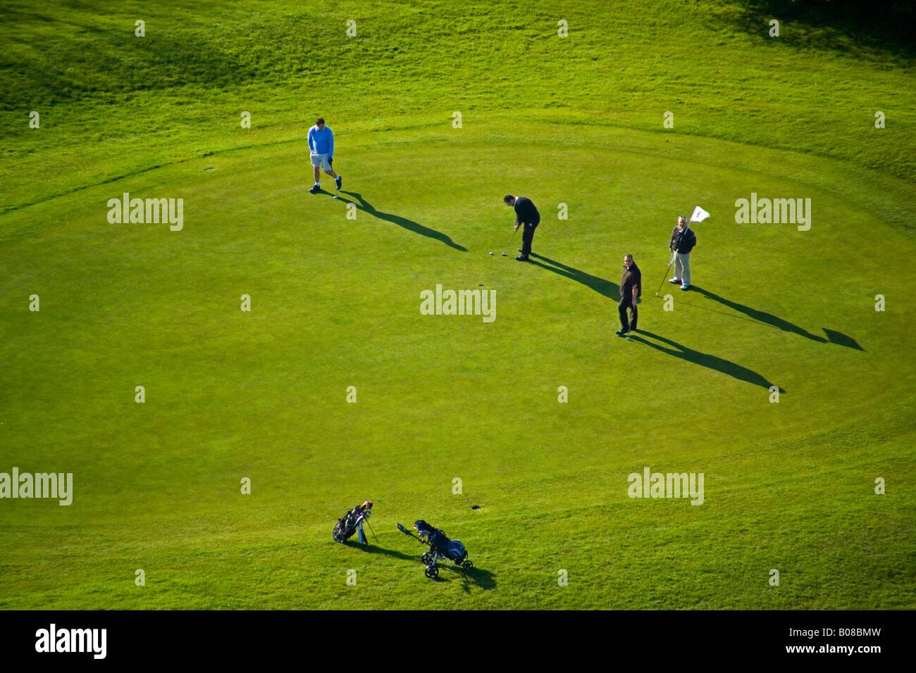 aerial view of golf players on the putting green Stock Photo