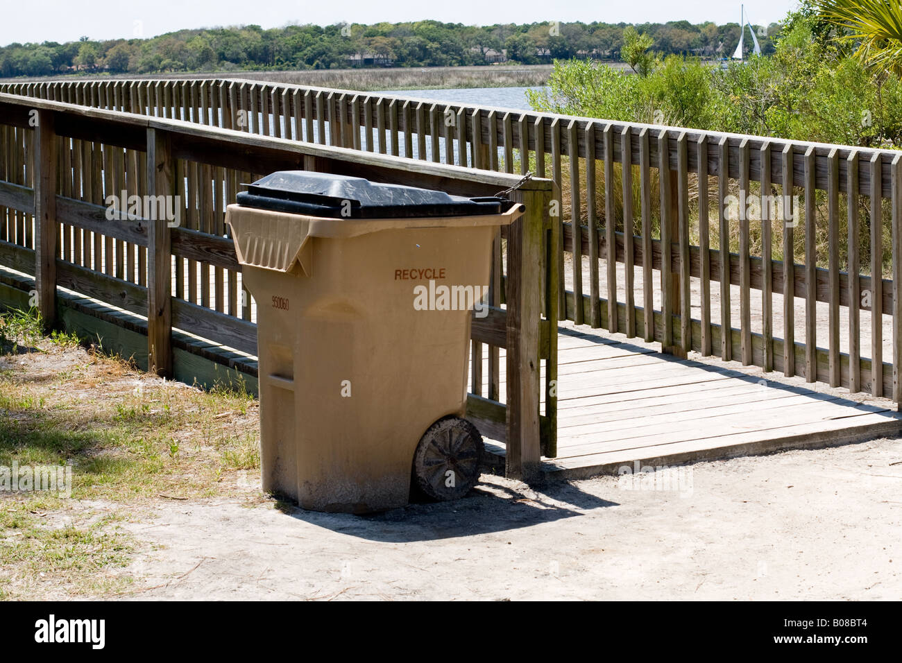 Plastic waste recycling tub near a wooden boat ramp by the Intracoastal