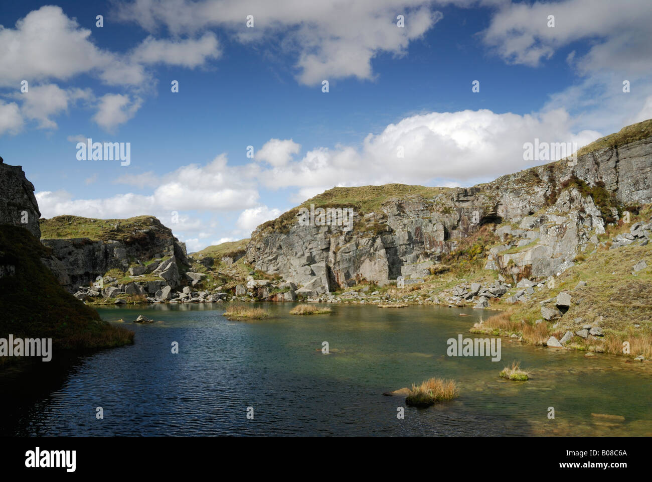 View across the lake at Foggintor Quarry (disused), Dartmoor, UK Stock Photo