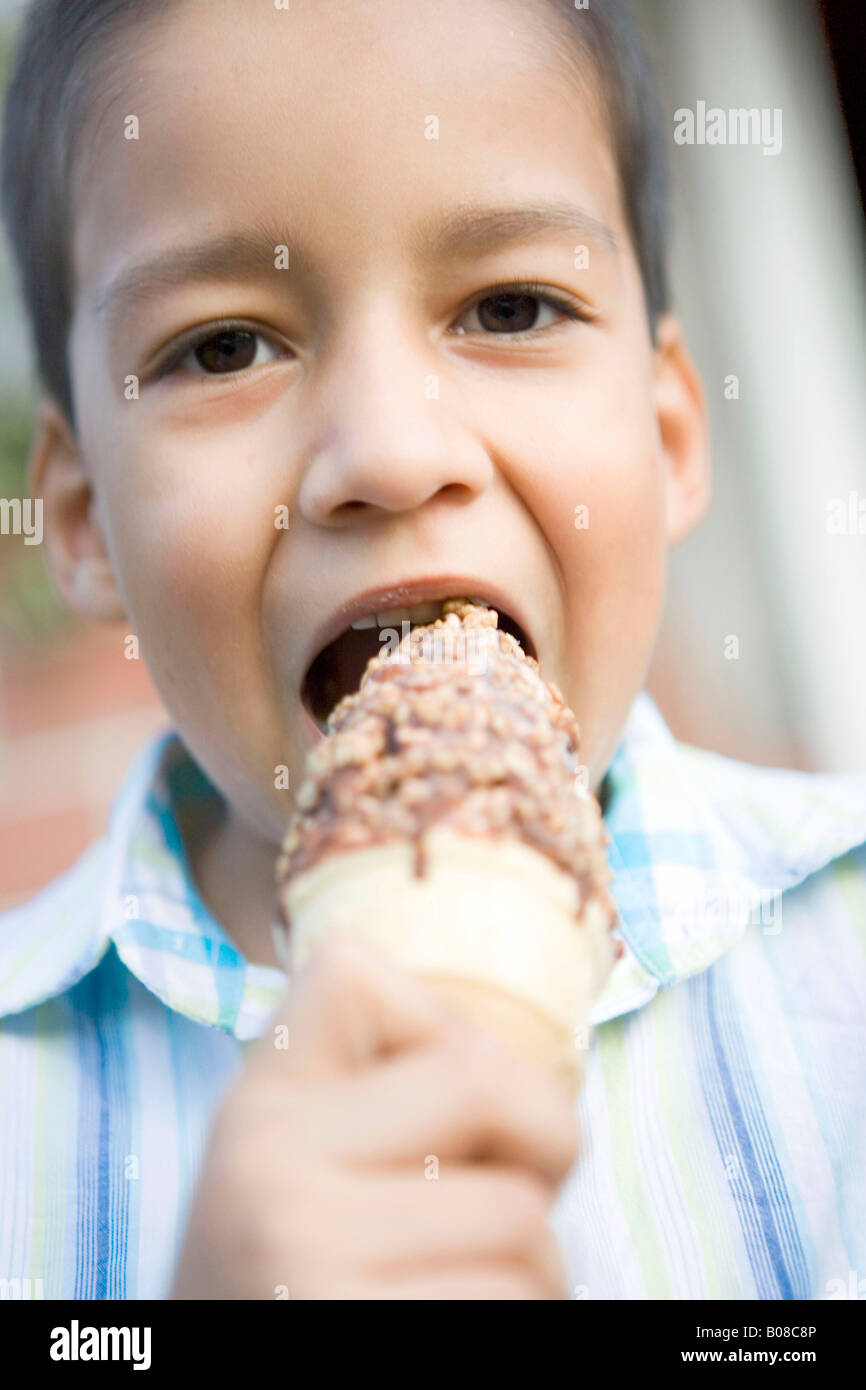 Boy Eating Ice Cream Cone Stock Photo - Alamy