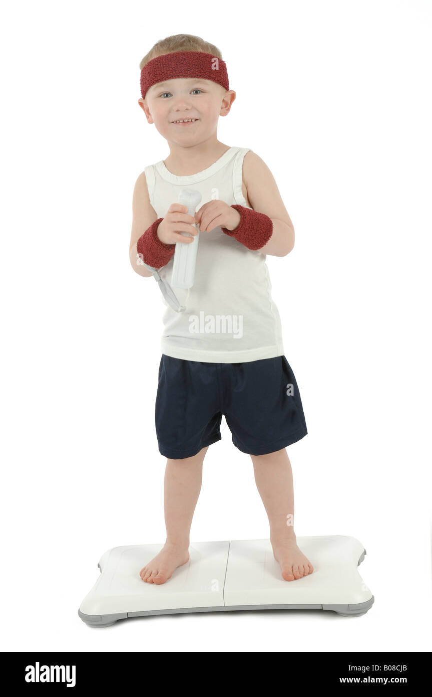 a toddler exercising on a nintendo wii fit balance board Stock Photo - Alamy