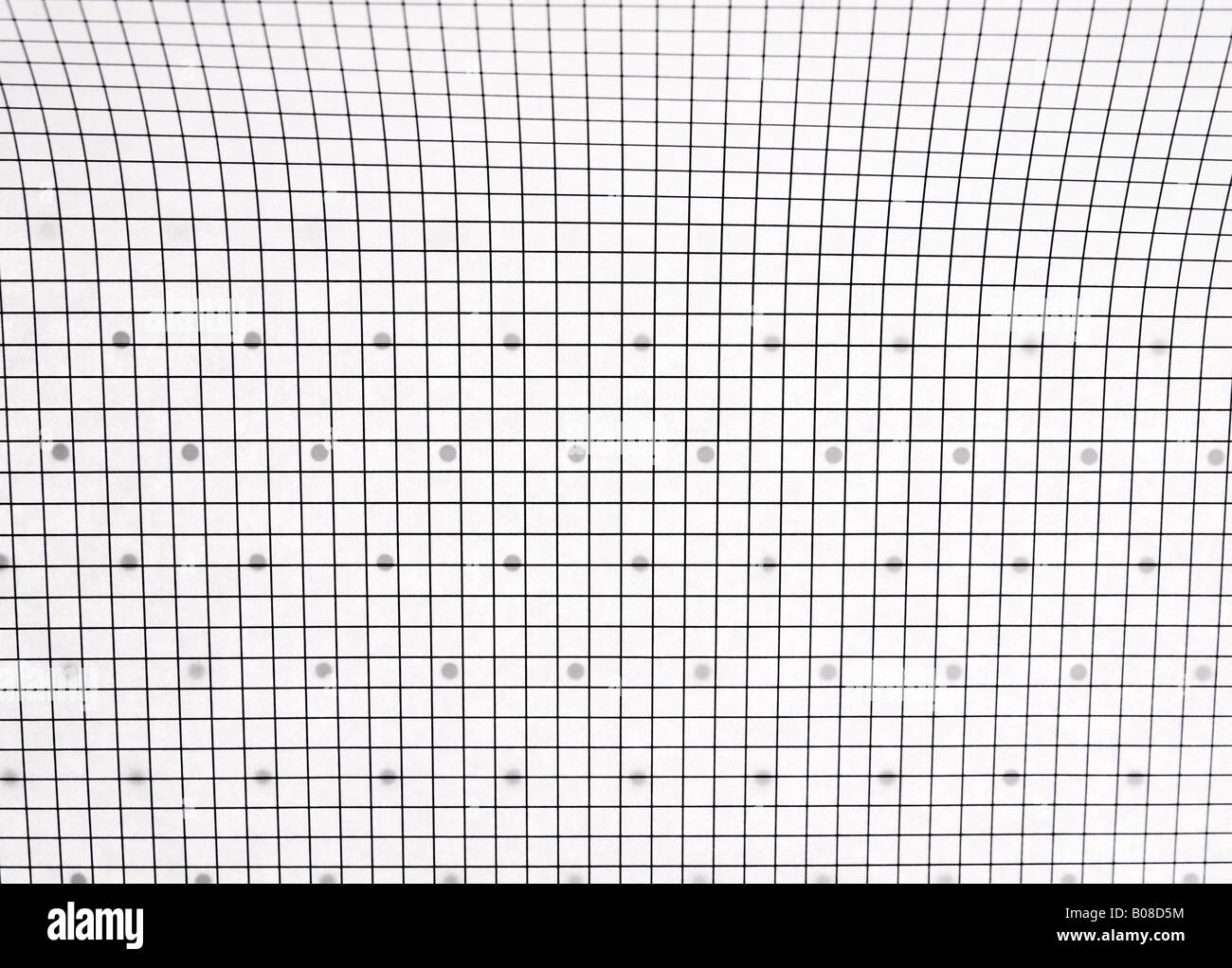a sheet of regular graph paper over a dot graph page Stock Photo