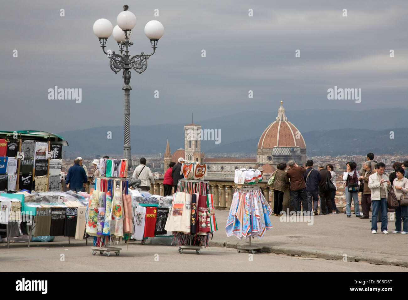 tourists on Piazza Michelangelo Florence and the stalls of street traders Stock Photo