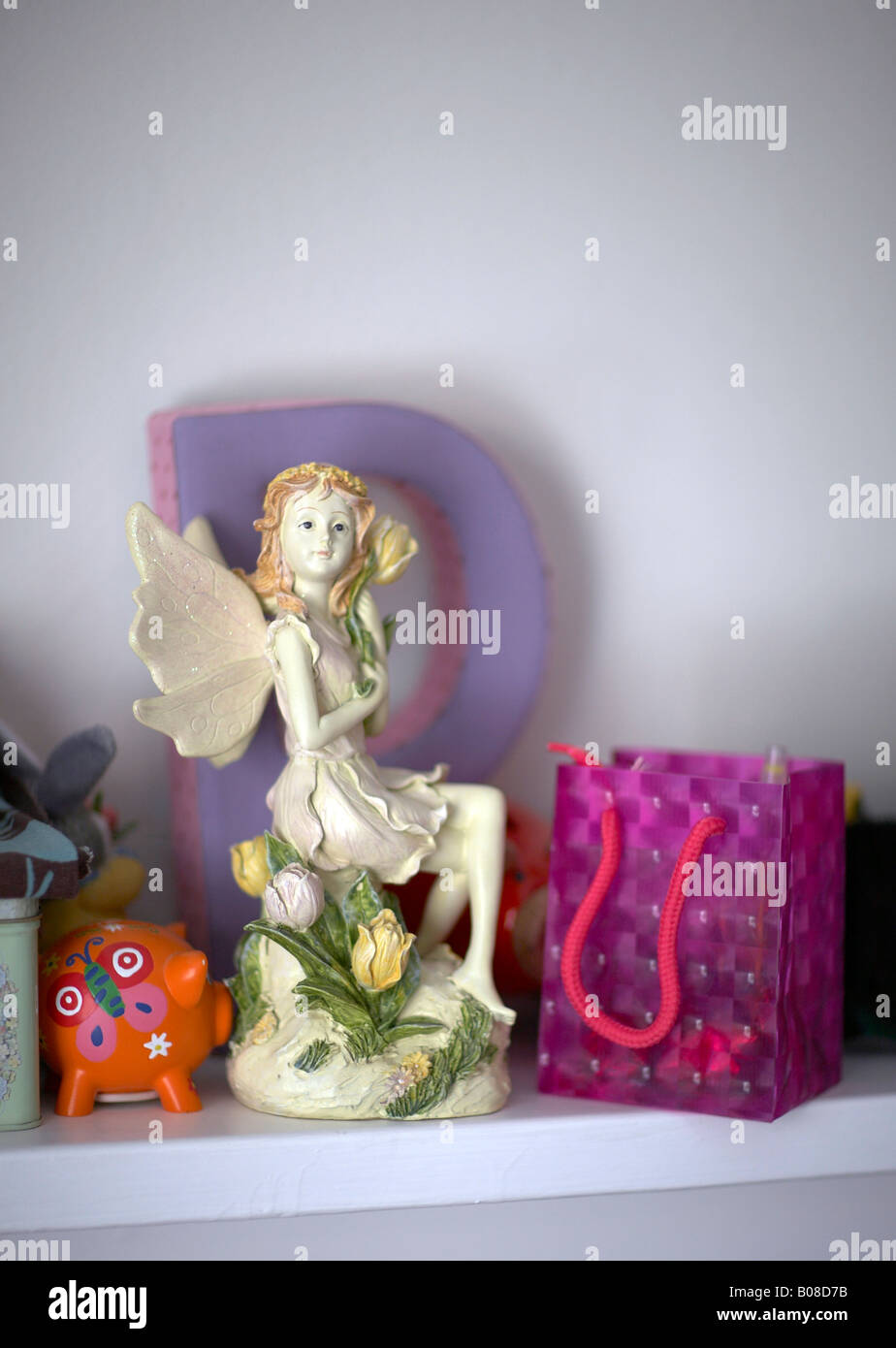 Ornaments on little girls bedroom bookshelf Stock Photo Alamy