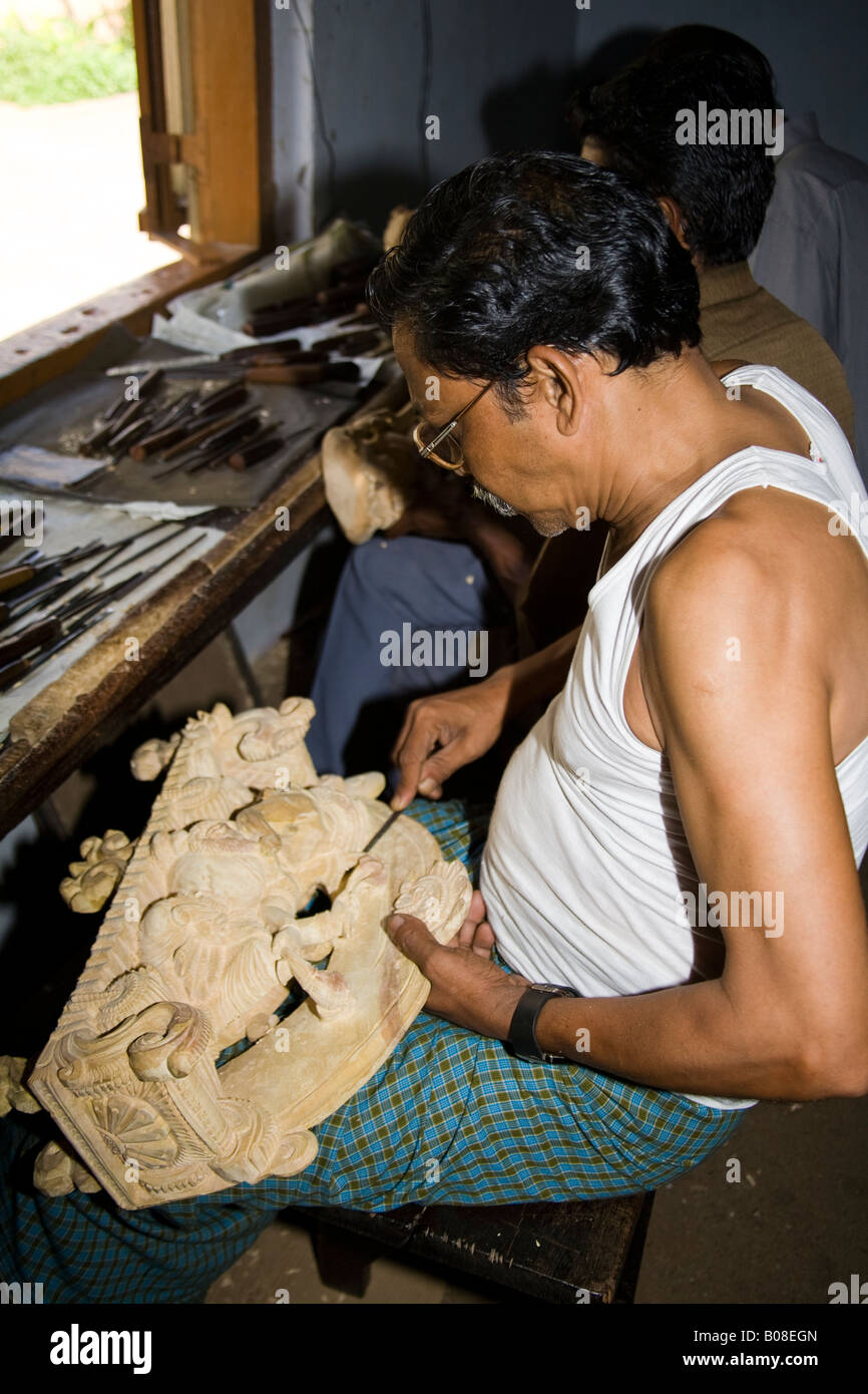 Man carving a religious artifact, Sree Padmanabhaswamy Temple, Trivandrum, Kerala, India Stock Photo
