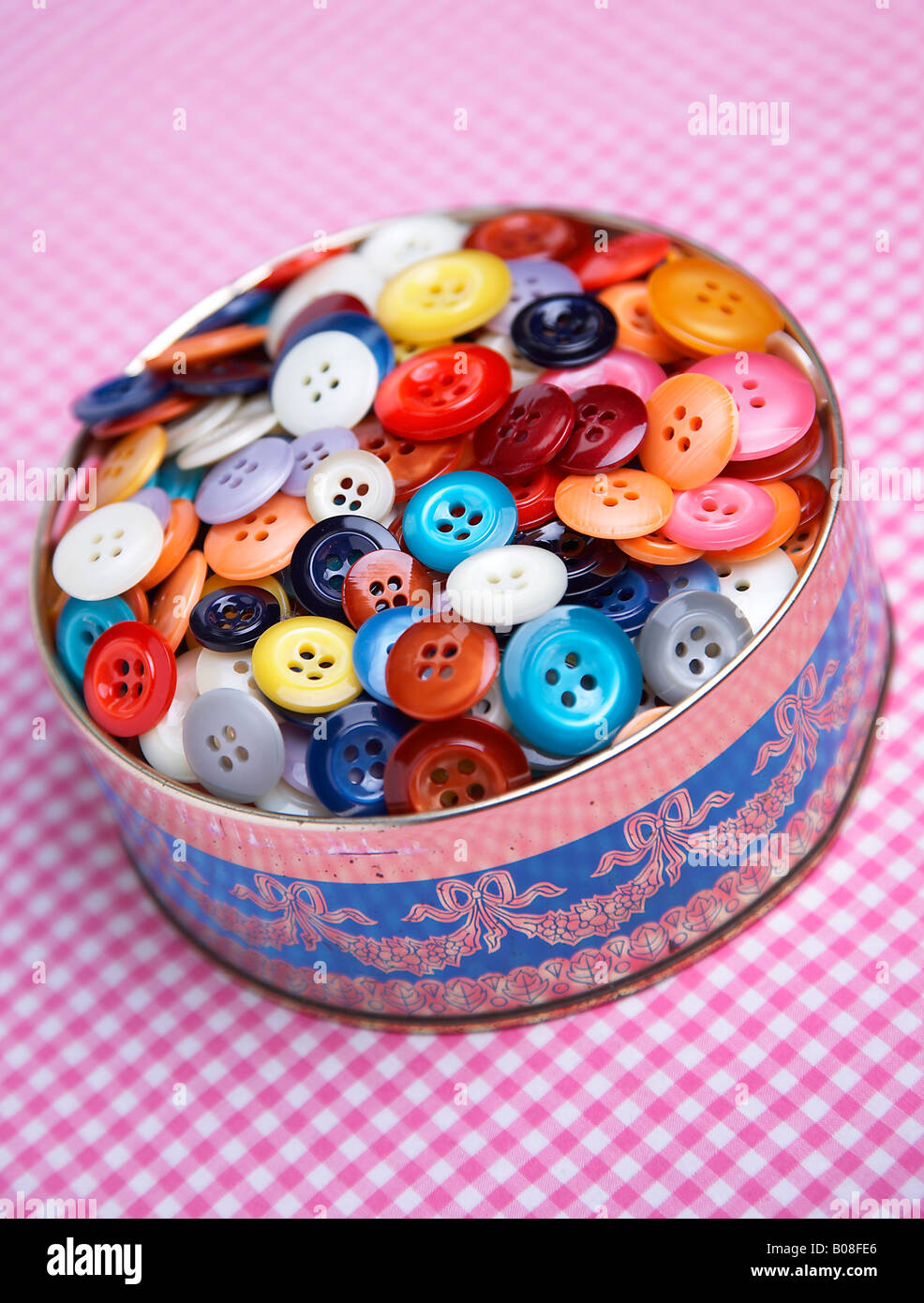Tin of buttons Stock Photo