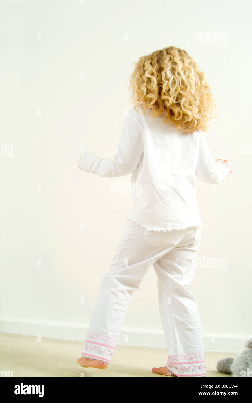 Little girl playing with stuffed animal Stock Photo - Alamy