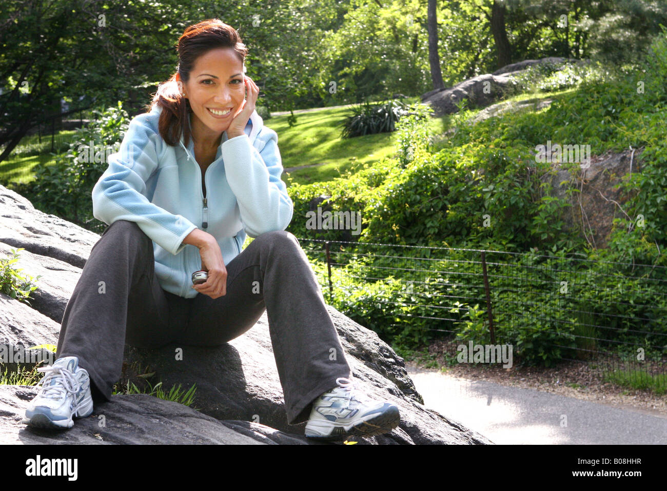 Portrait of woman at the park Stock Photo - Alamy