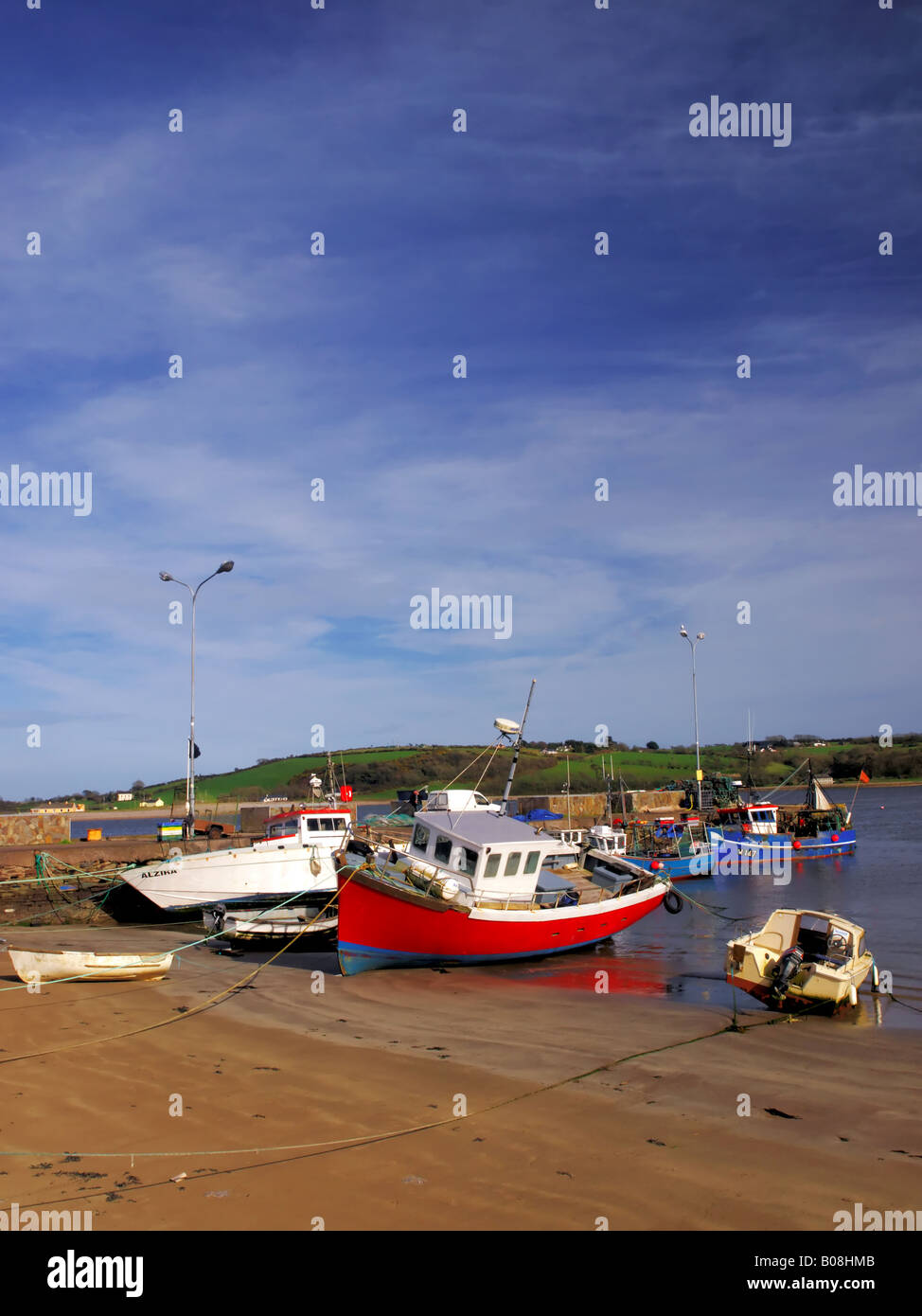 fishing boats moored at Youghal Co Cork during low tide Stock Photo Alamy