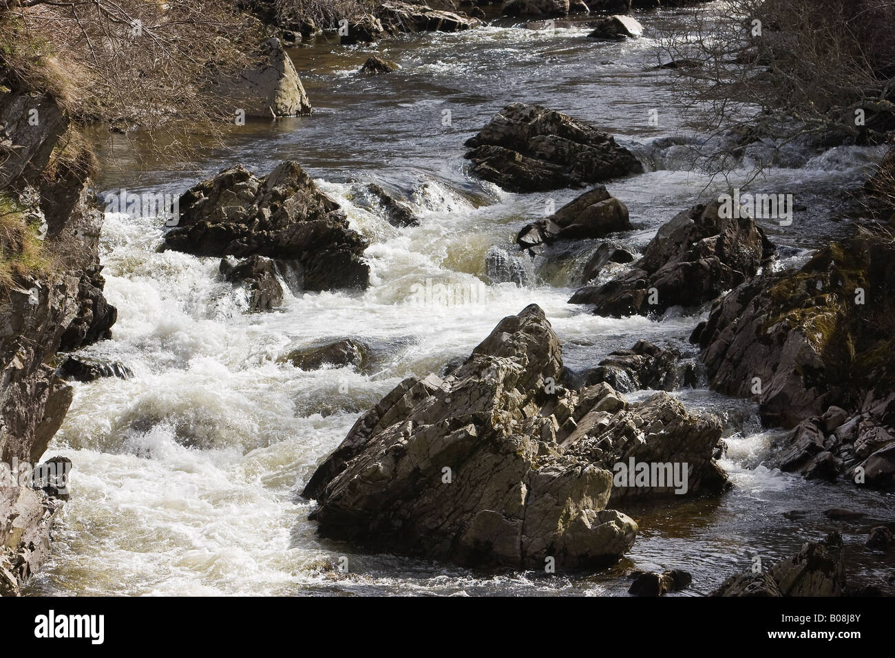 Water falling at the river Clunie as it passes Braemar on its way to joining the river Dee Stock Photo