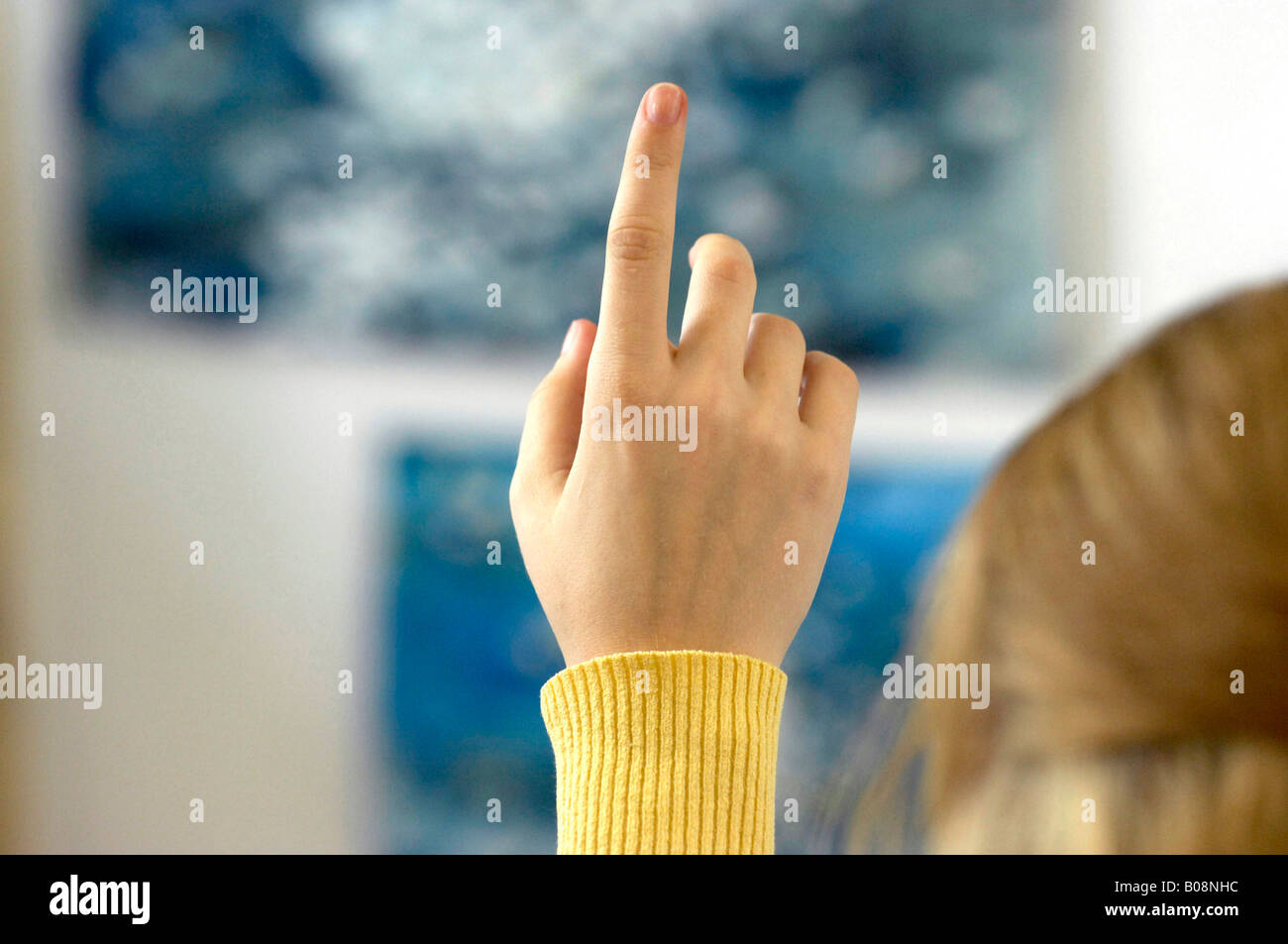 School lesson, student raising his hand in a secondary design school, Hesse, Germany Stock Photo