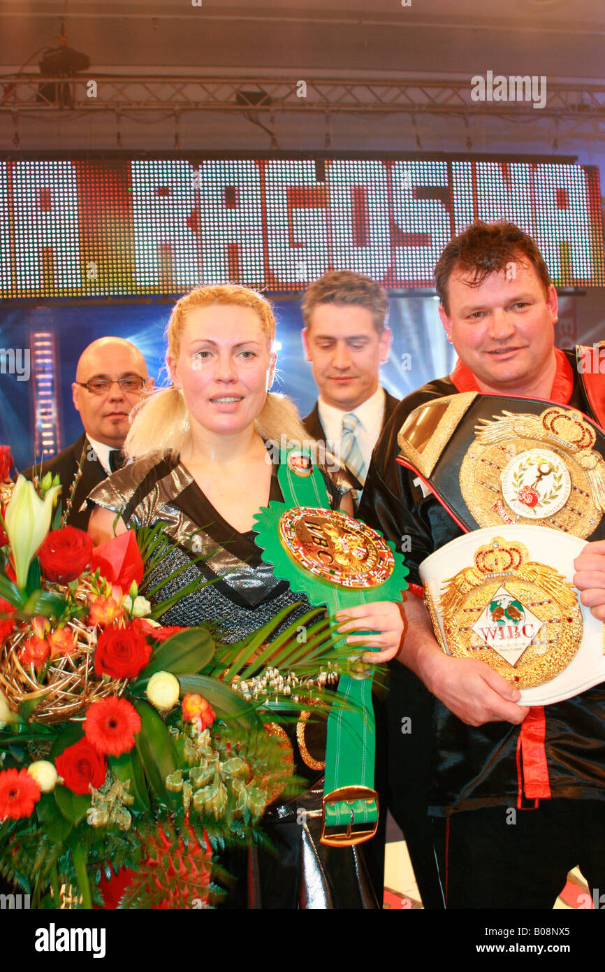 Natascha Ragosina and corner man Joerg Hohmann presenting her seventh World Title Belt in super middleweight boxing after beati Stock Photo